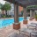 pergola covered poolside loungers
