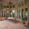 spacious leasing office porch with table, chairs and ceiling fan